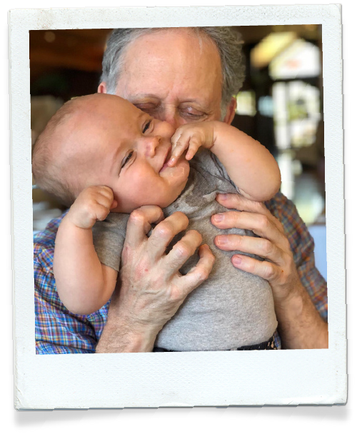 Dr Leon Levitt with his grandchild