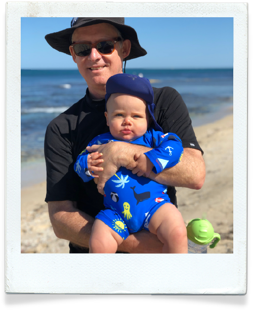 Dr Leon Levitt with his grandson at the beach